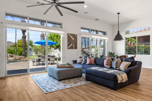 a spacious bathroom with a granite countertop tub a sink and a large mirror