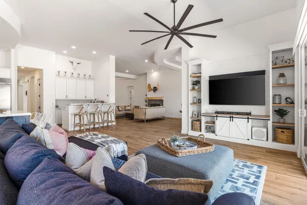 a living room with furniture and a flat screen tv