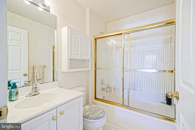 a view of a livingroom with wooden floor and a window