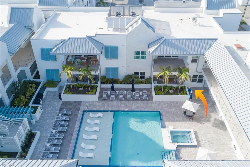 201 8th Street South, Unit 208 Naples, FL 34102 - Photo 3 of 39 a view of a house with a patio