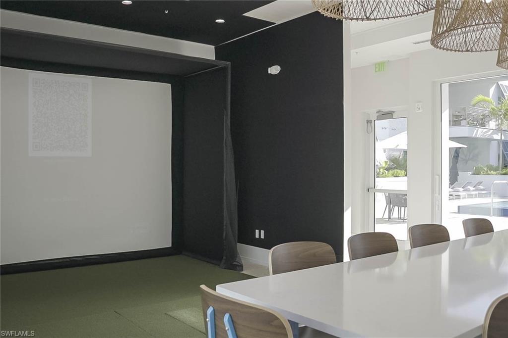 201 8th Street South, Unit 208 Naples, FL 34102 - Photo 31 of 39 Golf simulator in community room with bathrooms, and sauna - all on the 2nd level -just steps from the patio of unit #208