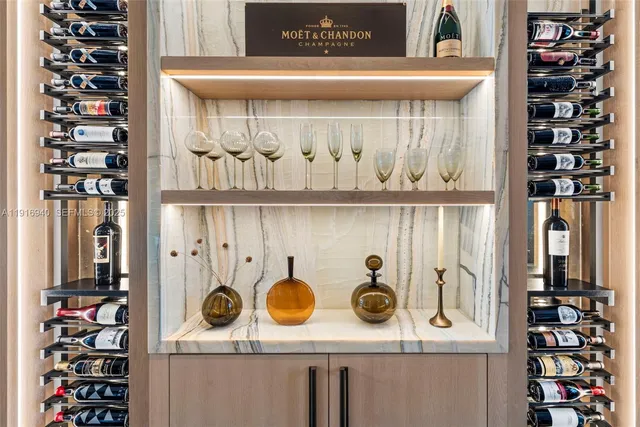 a kitchen with cabinets and wooden floor