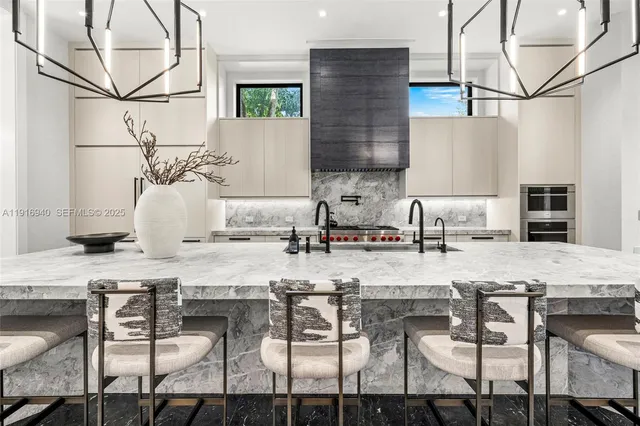 a living room with furniture and large windows