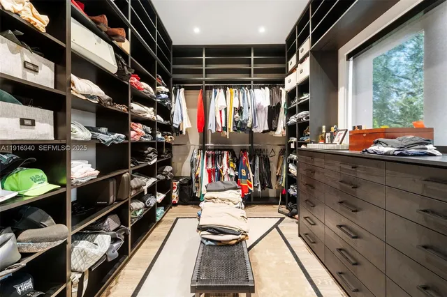 a bedroom with a large bed and a large window