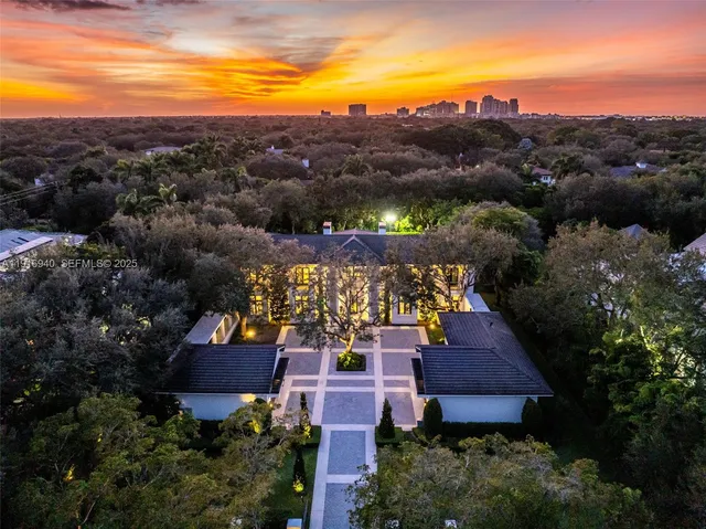 a living room with fireplace furniture and a large window