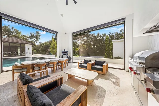 an aerial view of house with yard swimming pool and outdoor seating