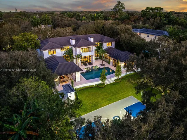 a view of a yard with a house in the background