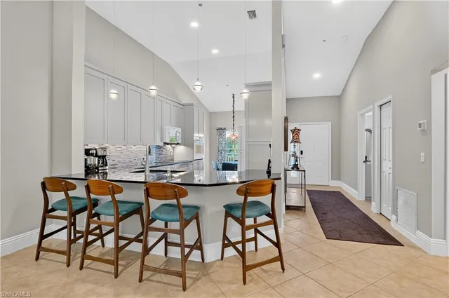 a group of people sitting on a kitchen counter top space