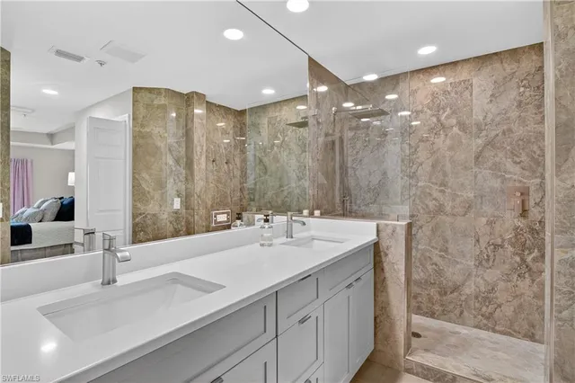 a bedroom with two beds and a window