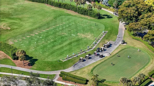 an aerial view of a house swimming pool and outdoor seating