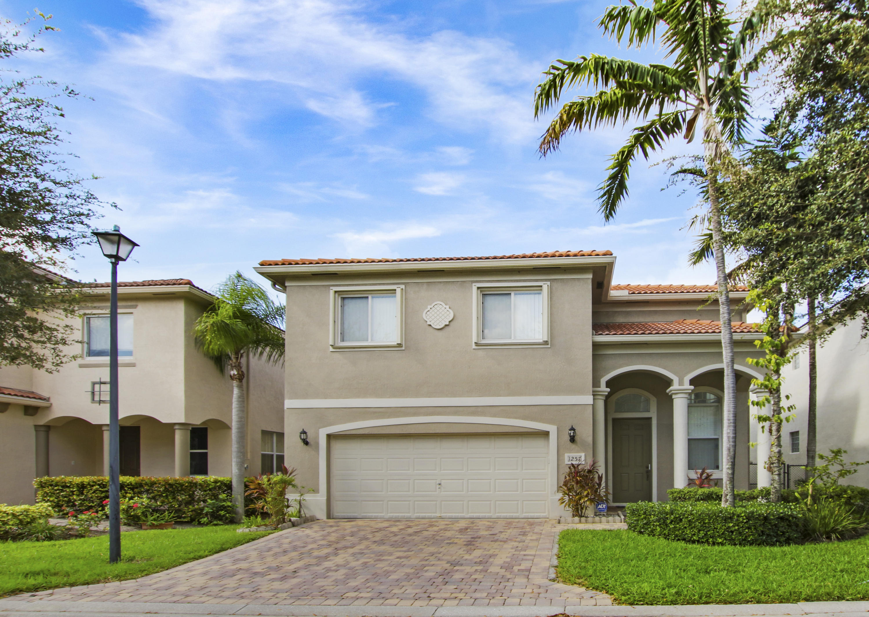 1257 Rose Gate Boulevard Riviera Beach, FL 33404 - Photo 1 of 32 Front