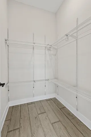 a view of an empty walk in closet