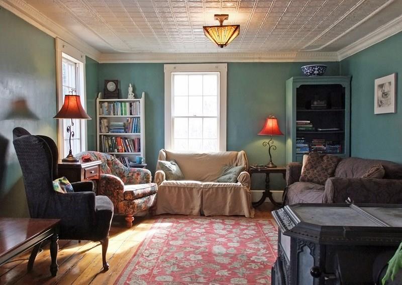 649 Naskeag Point Road Brooklin, ME 04616 - Photo 17 of 25 Living Room with beautiful tin ceiling