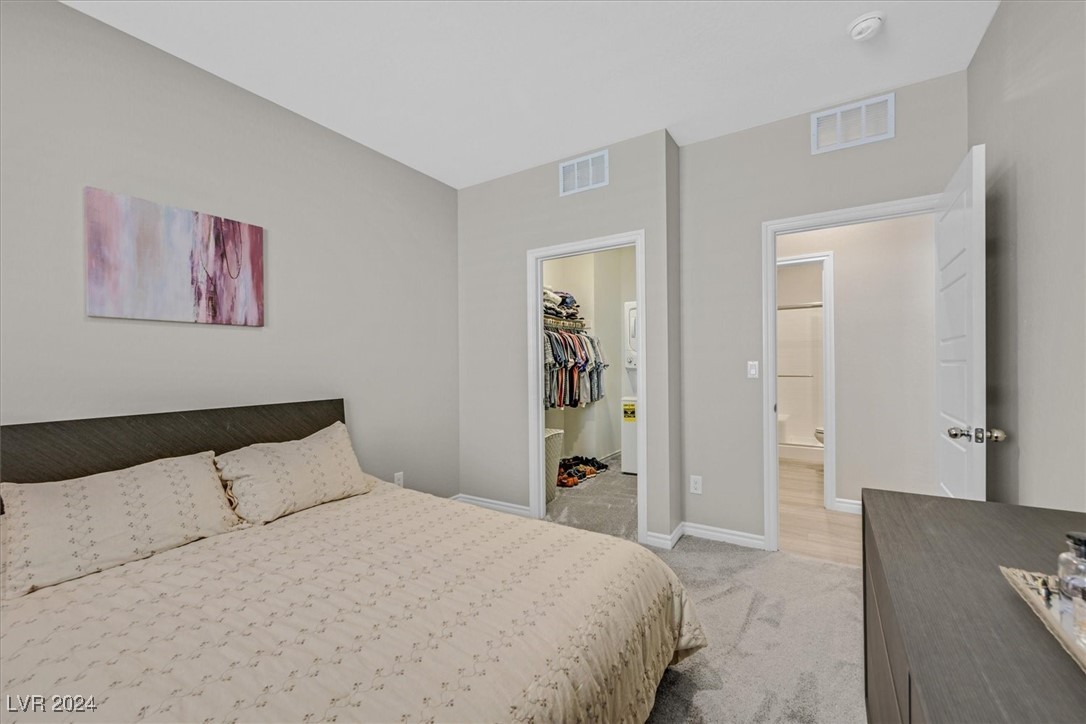 271 Rusty Ridge Lane Henderson, NV 89015 - Photo 41 of 52 Next Gen Bedroom with walk in closet washer dryer