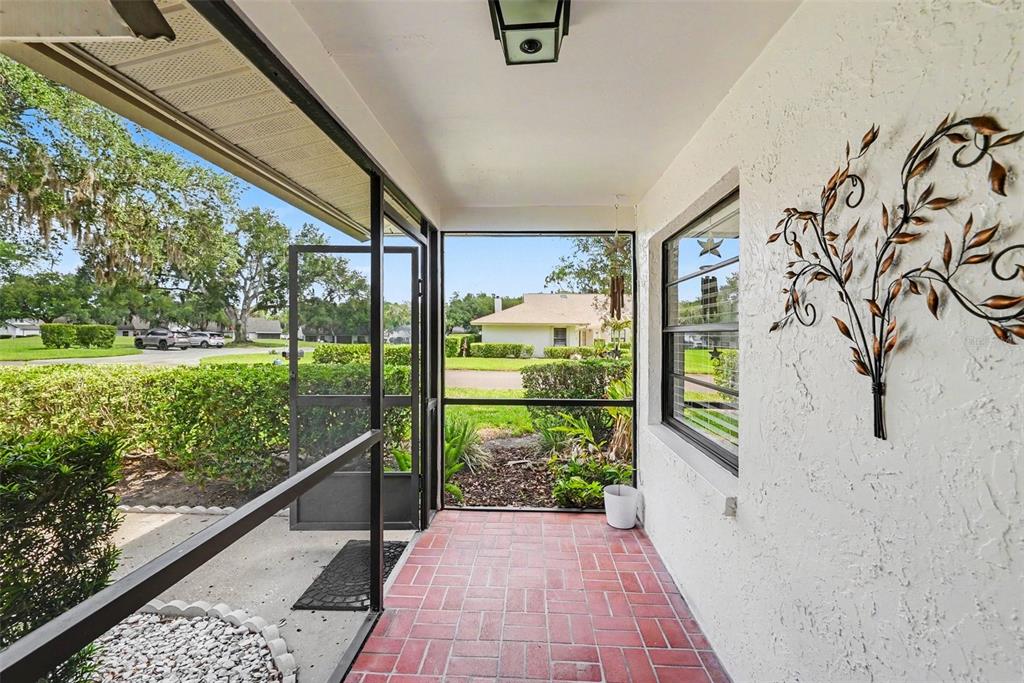 9204 Golf View Drive New Port Richey, FL 34655 - Photo 27 of 33 a view of a garden from a window
