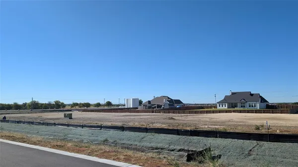 a view of a road with an ocean view