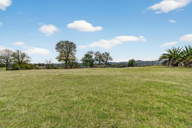 a view of an ocean and a yard