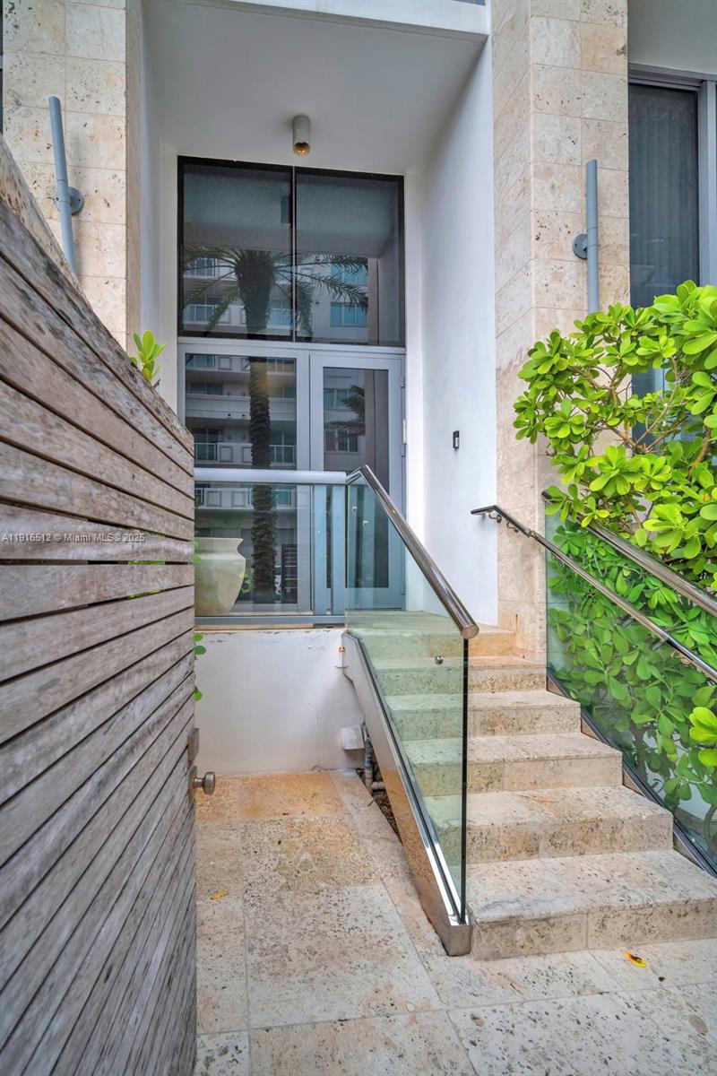 9501 Collins Avenue, Unit 1 Surfside, FL 33154 - Photo 12 of 53 a view of entryway with a front door