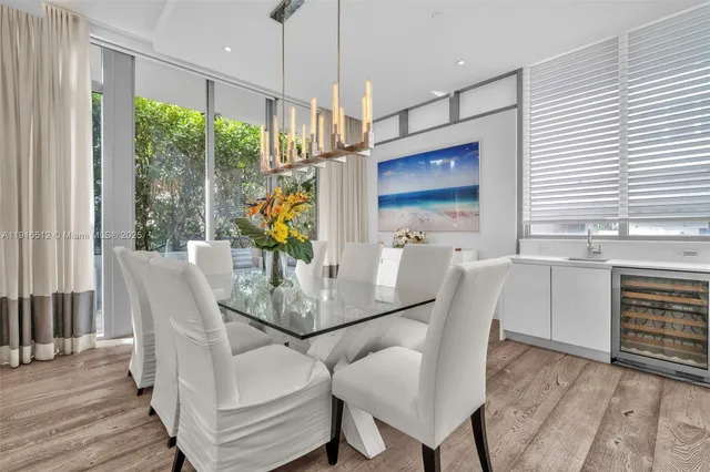 a dining room with furniture and wooden floor