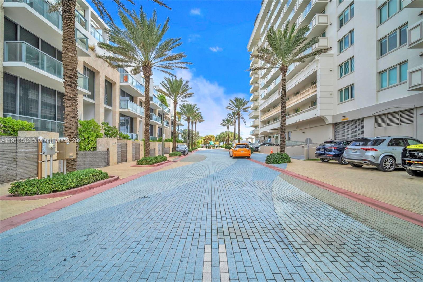 9501 Collins Avenue, Unit 1 Surfside, FL 33154 - Photo 2 of 53 a cars parked on the side of a street