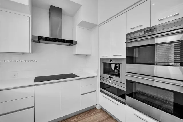 a bathroom with a granite countertop sink a toilet and a mirror