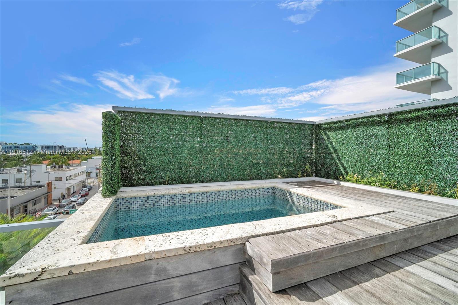 9501 Collins Avenue, Unit 1 Surfside, FL 33154 - Photo 46 of 53 a view of a swimming pool with a yard