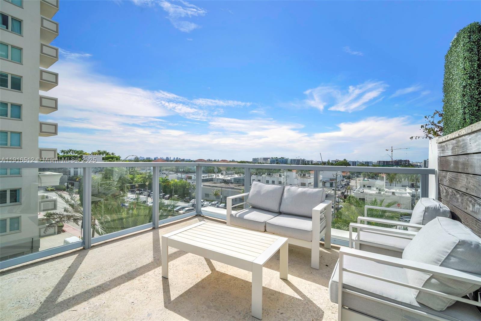 9501 Collins Avenue, Unit 1 Surfside, FL 33154 - Photo 49 of 53 a view of a terrace with couches and city view