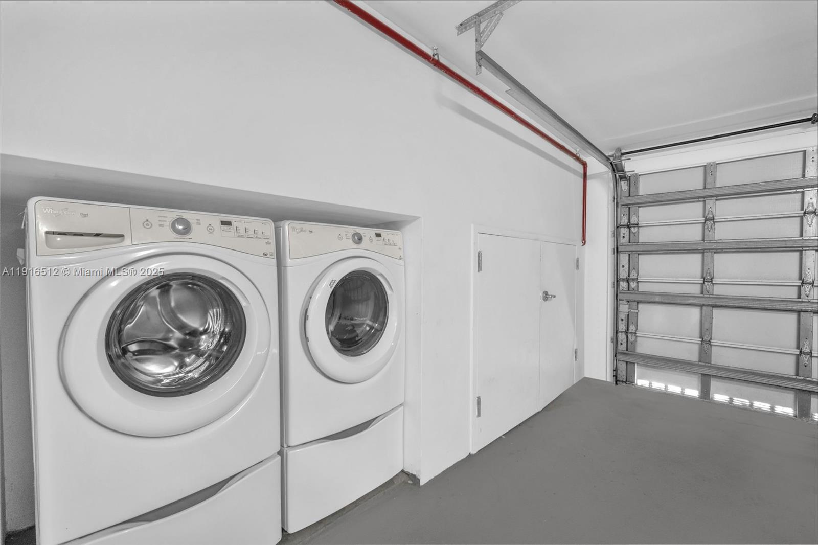 9501 Collins Avenue, Unit 1 Surfside, FL 33154 - Photo 50 of 53 a view of a storage & utility room with washer and dryer