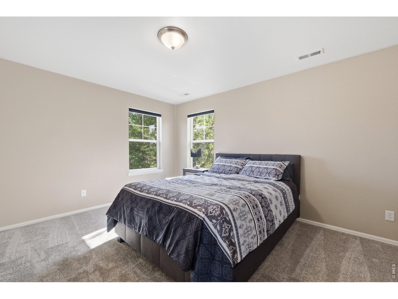 8709 Tack Street Frederick, CO 80504 - Photo 24 of 43 a bedroom with a bed and a window