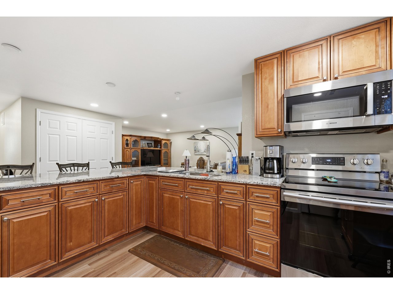8709 Tack Street Frederick, CO 80504 - Photo 31 of 43 a kitchen with stainless steel appliances a sink stove and microwave
