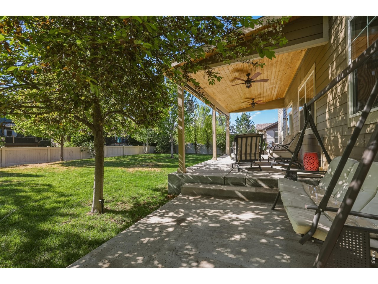 8709 Tack Street Frederick, CO 80504 - Photo 39 of 43 a view of a yard with plants and a table