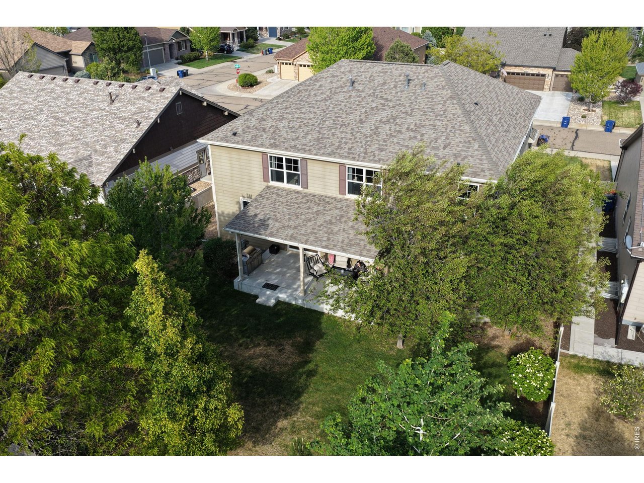 8709 Tack Street Frederick, CO 80504 - Photo 40 of 43 a aerial view of a house with yard and trees in the background