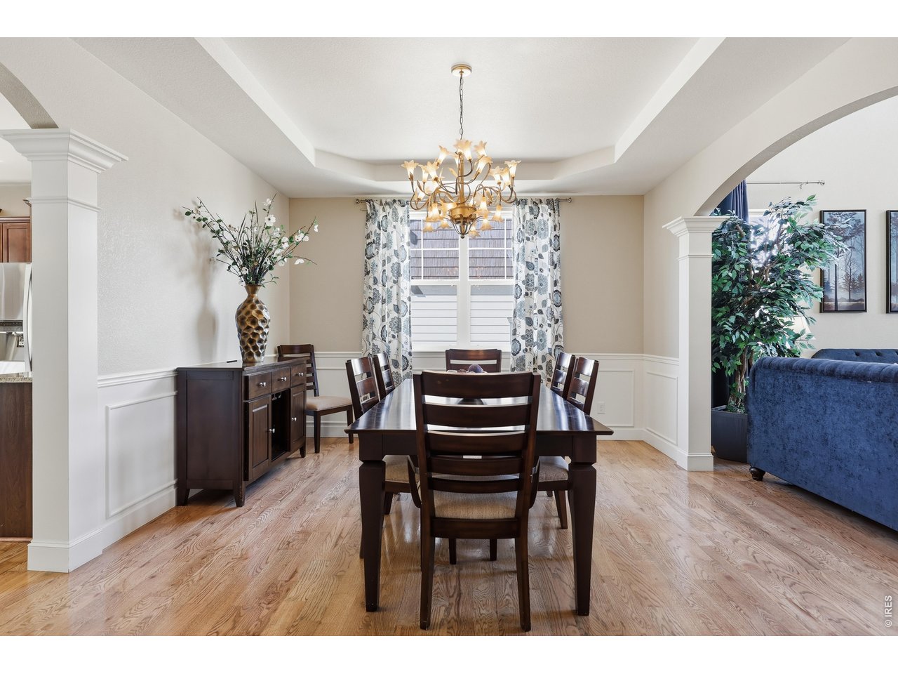 8709 Tack Street Frederick, CO 80504 - Photo 9 of 43 a view of a dining room with furniture window and wooden floor