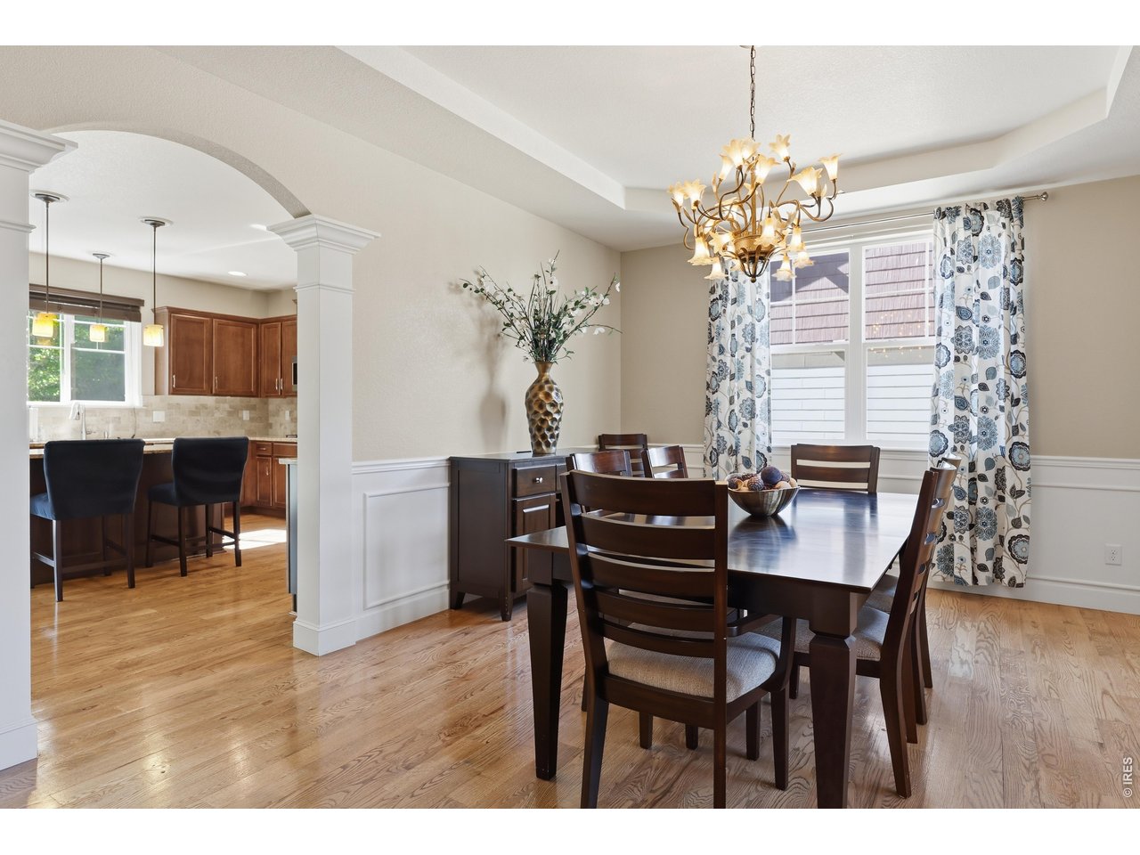 8709 Tack Street Frederick, CO 80504 - Photo 10 of 43 a view of a dining room with furniture and wooden floor
