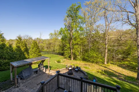 a view of a chairs and table on the deck