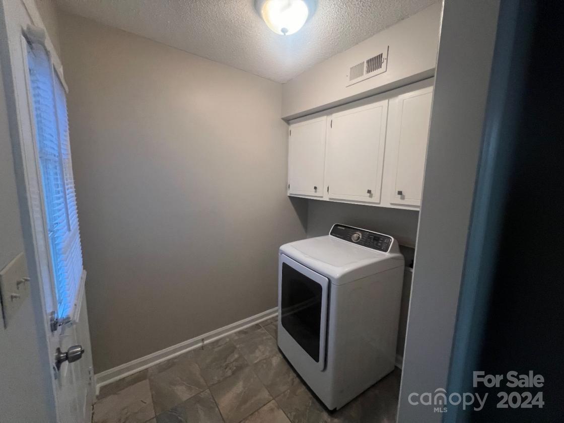 11714 Harrowfield Road Charlotte, NC 28226 - Photo 6 of 15 a utility room with dryer and washer