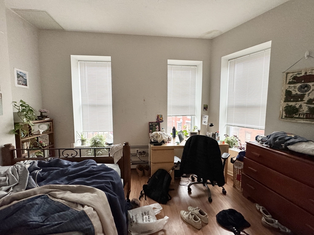 96 Hammond Street, Unit 2 Boston, MA 02120 - Photo 5 of 7 a living room with furniture and a large window