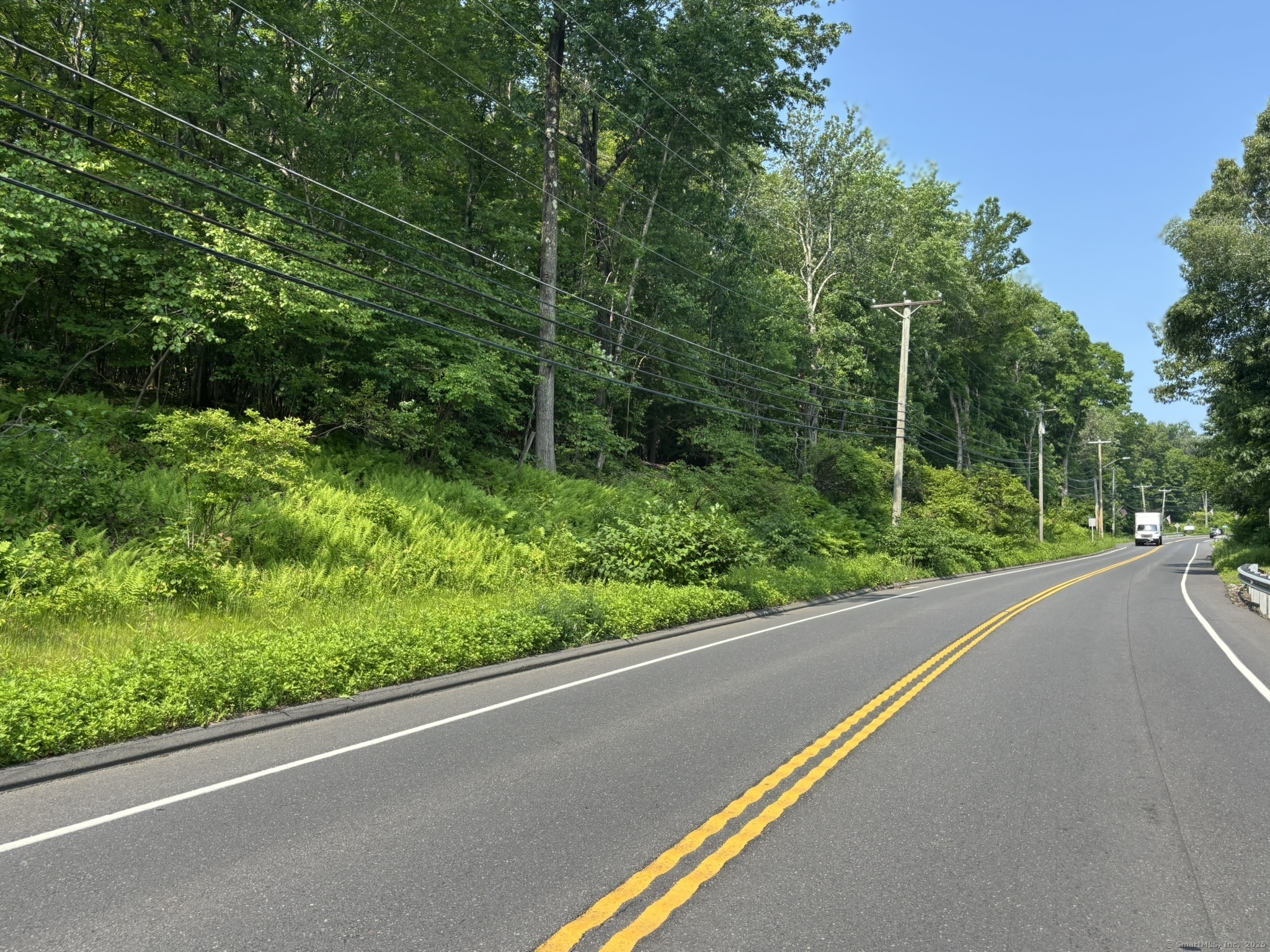 44 Cheshire Road Prospect, CT 06712 - Photo 23 of 39 a view of a street from a balcony