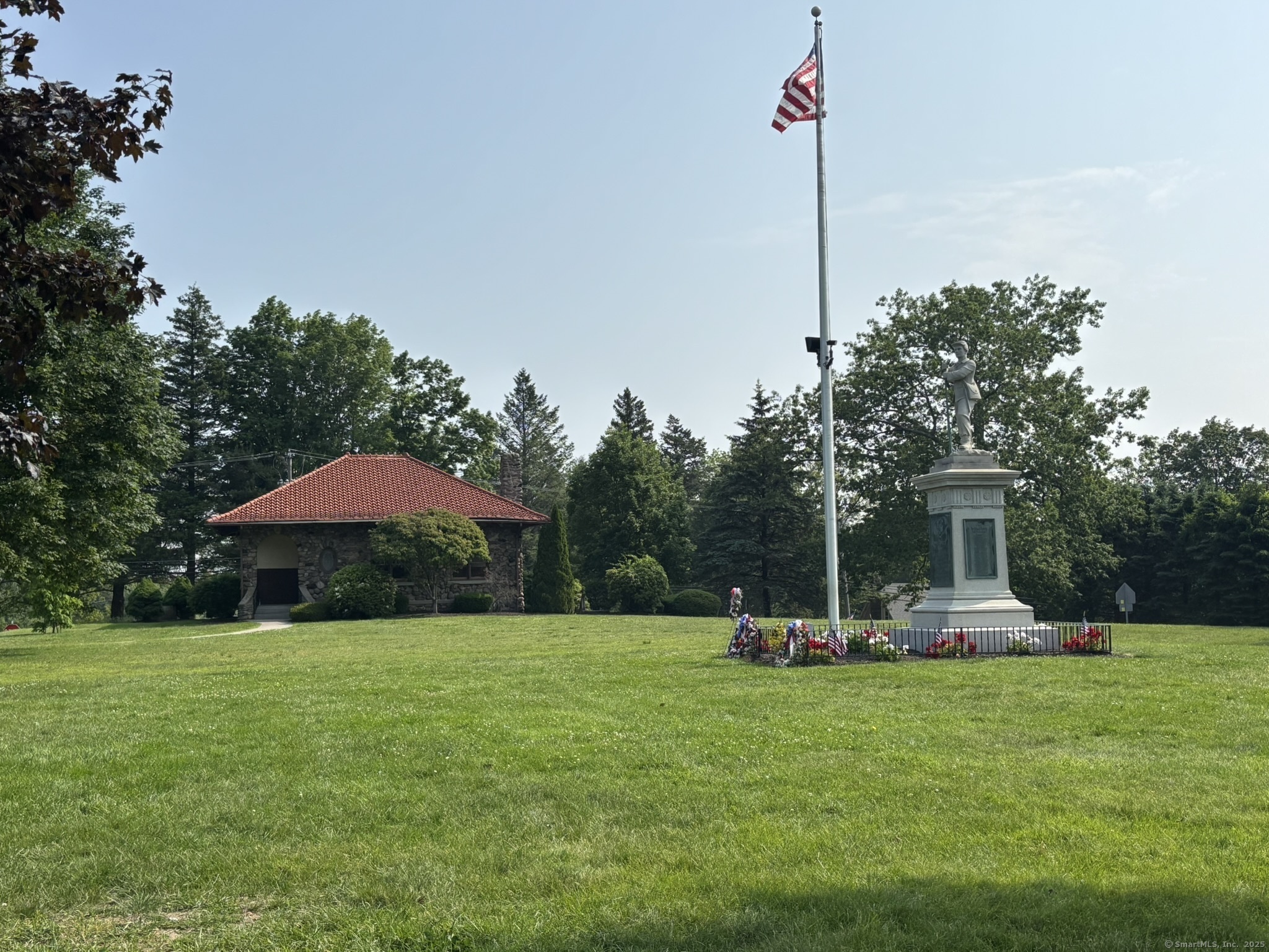 44 Cheshire Road Prospect, CT 06712 - Photo 27 of 39 a view of a table and chairs under an umbrella