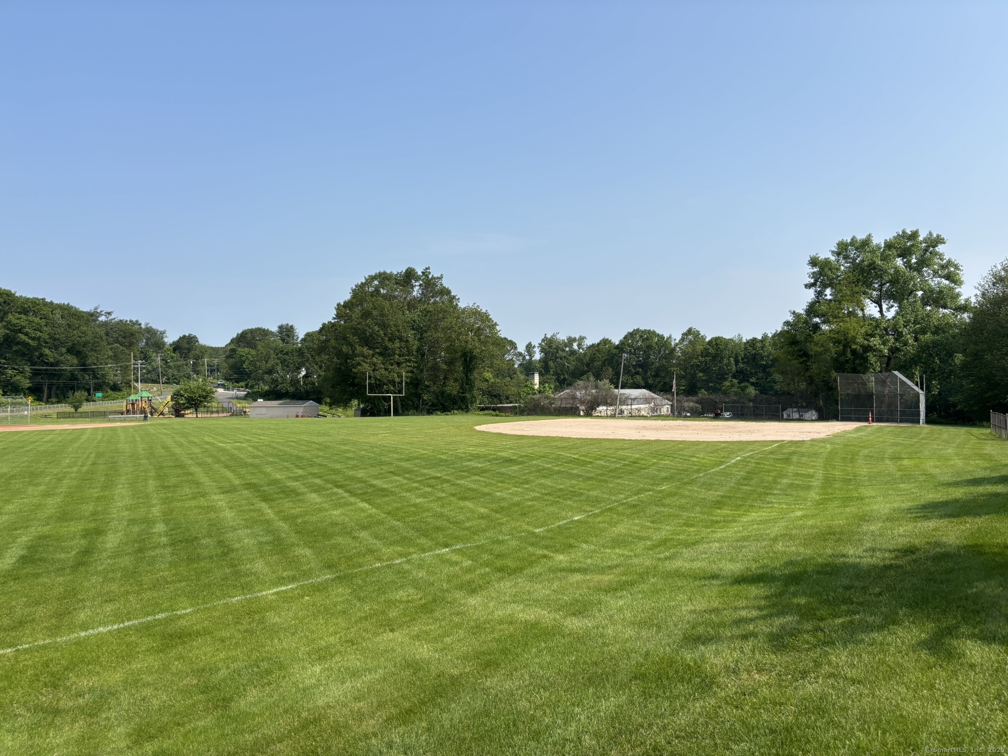 44 Cheshire Road Prospect, CT 06712 - Photo 36 of 39 a view of a green field with wooden fence