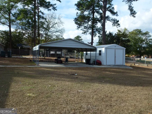 a view of a town with large trees