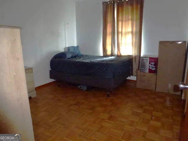 a room with a bed and a window