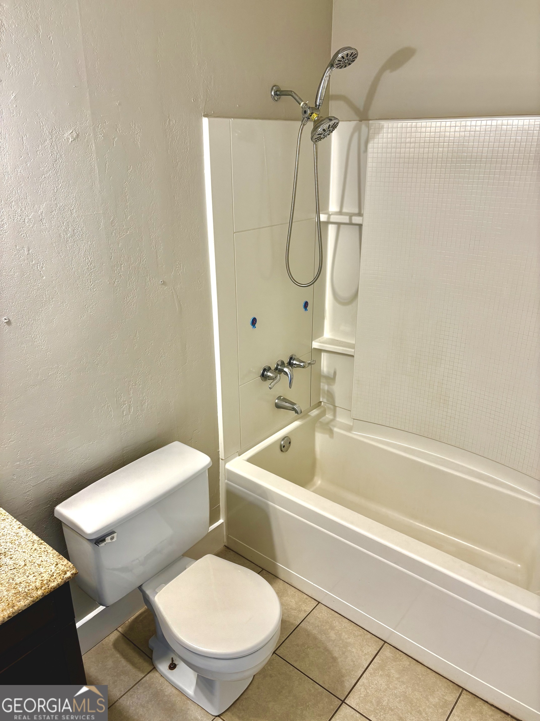 56 John Lovelace Road LaGrange, GA 30241 - Photo 20 of 26 a white toilet sitting next to a bath tub and a shower