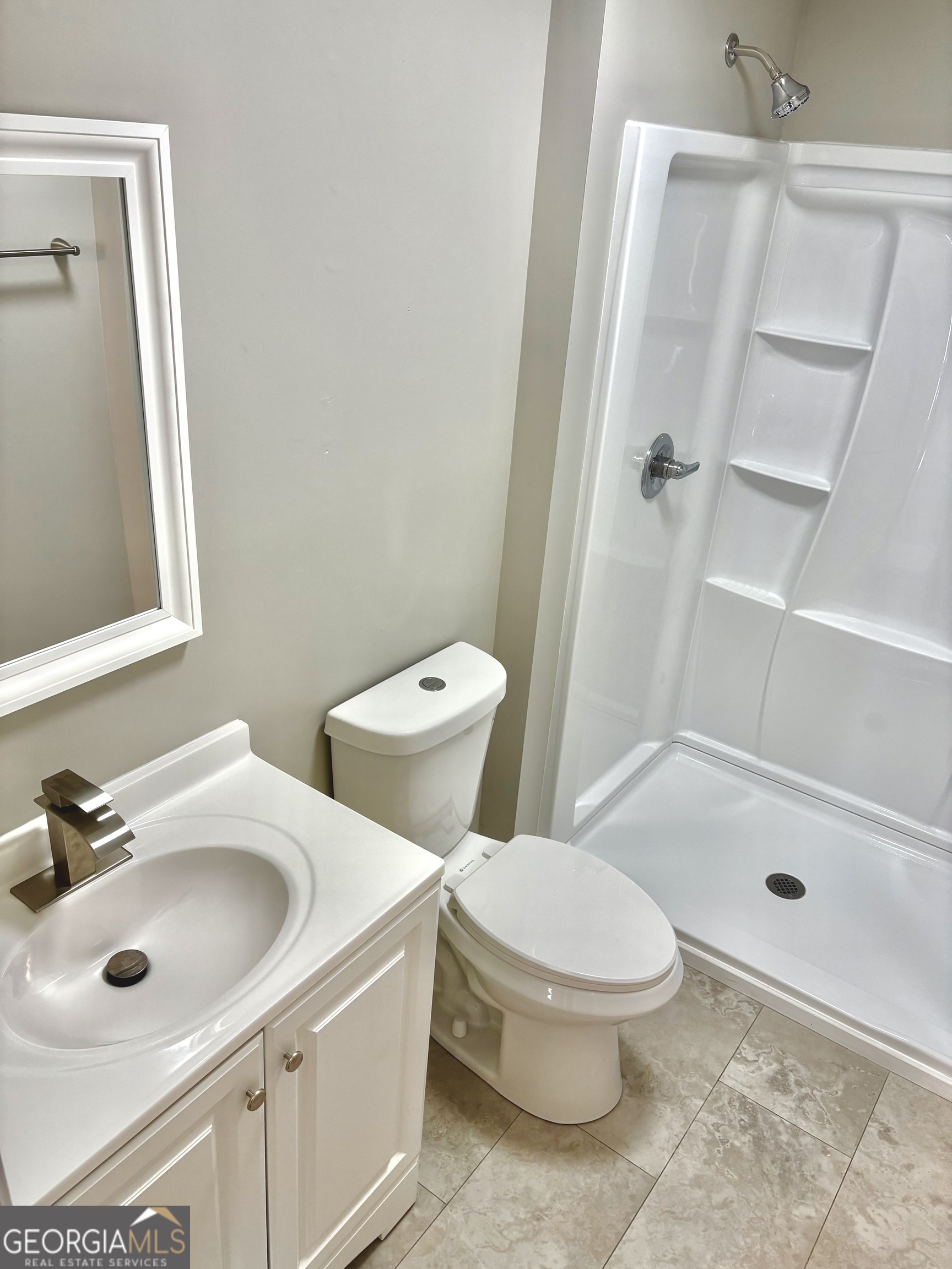 56 John Lovelace Road LaGrange, GA 30241 - Photo 24 of 26 a white toilet sitting next to a bathroom sink