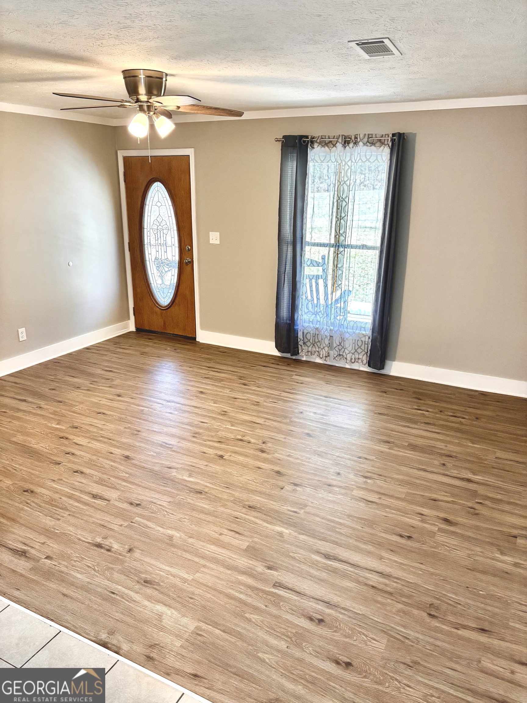 56 John Lovelace Road LaGrange, GA 30241 - Photo 9 of 26 a view of a room with wooden floor and window