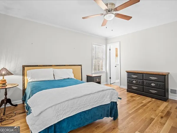 a bedroom with a bed and a dresser
