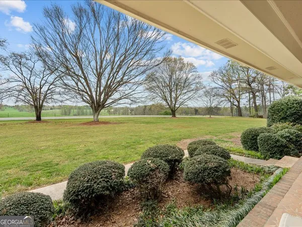 a view of a yard with an outdoor space and seating