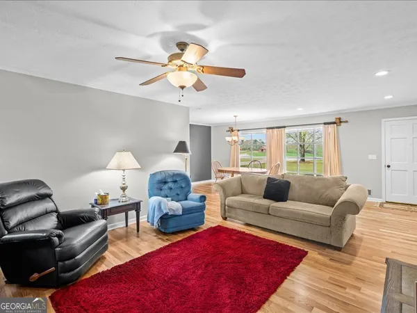 a living room with furniture a couch and chandelier