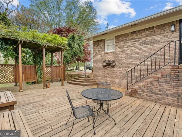 a backyard of a house with a large tree