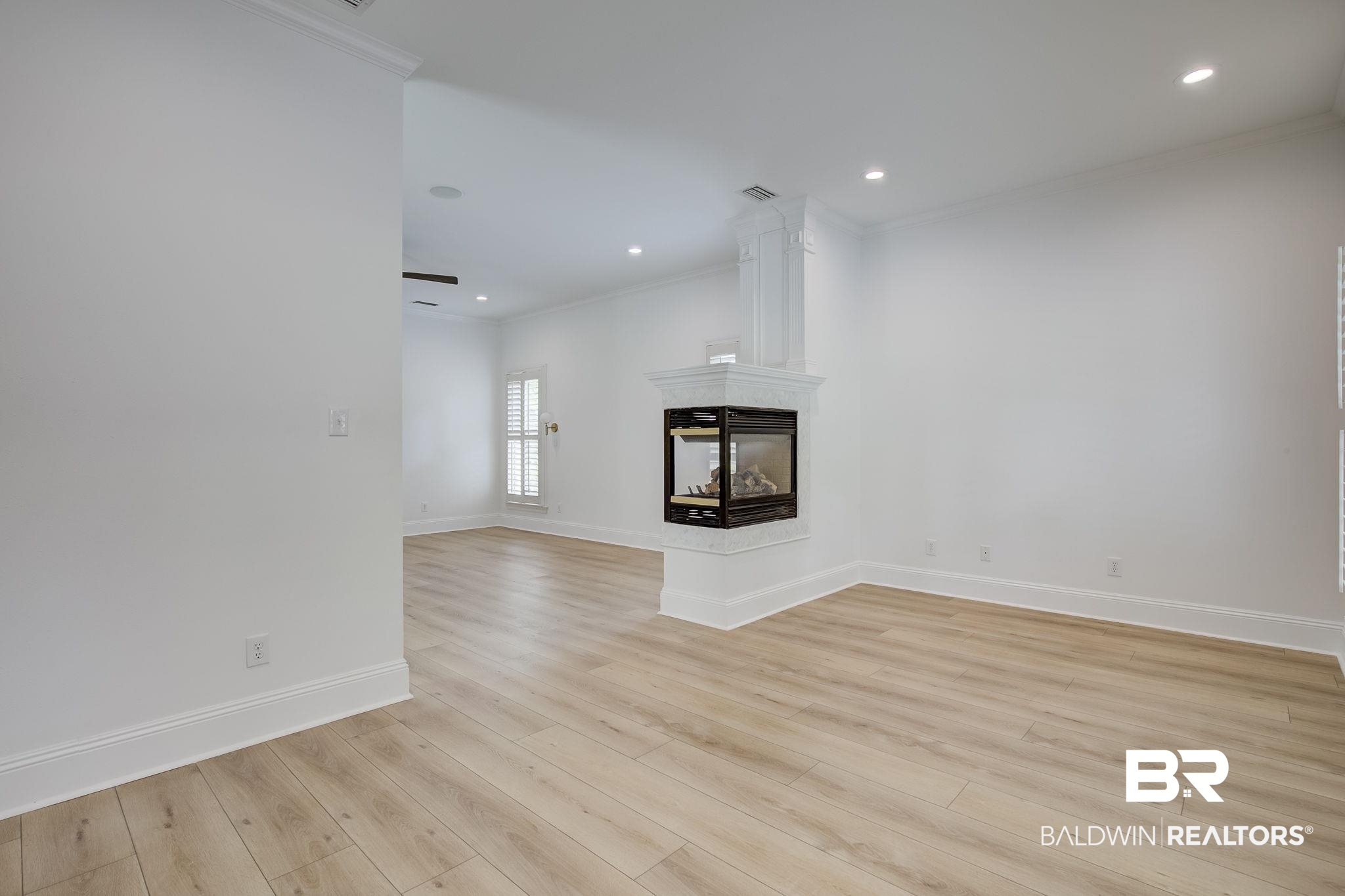 105 High Pines Ridge Fairhope, AL 36532 - Photo 47 of 97 Has baseboards, crown molding, light wood-type flooring, recessed lighting, and a multi sided fireplace